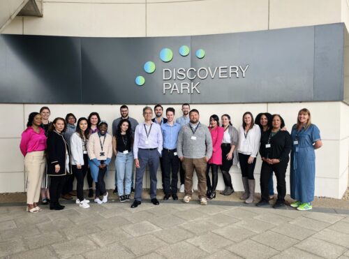 Discovery Spark cohort group photo in front of Discovery Park sign